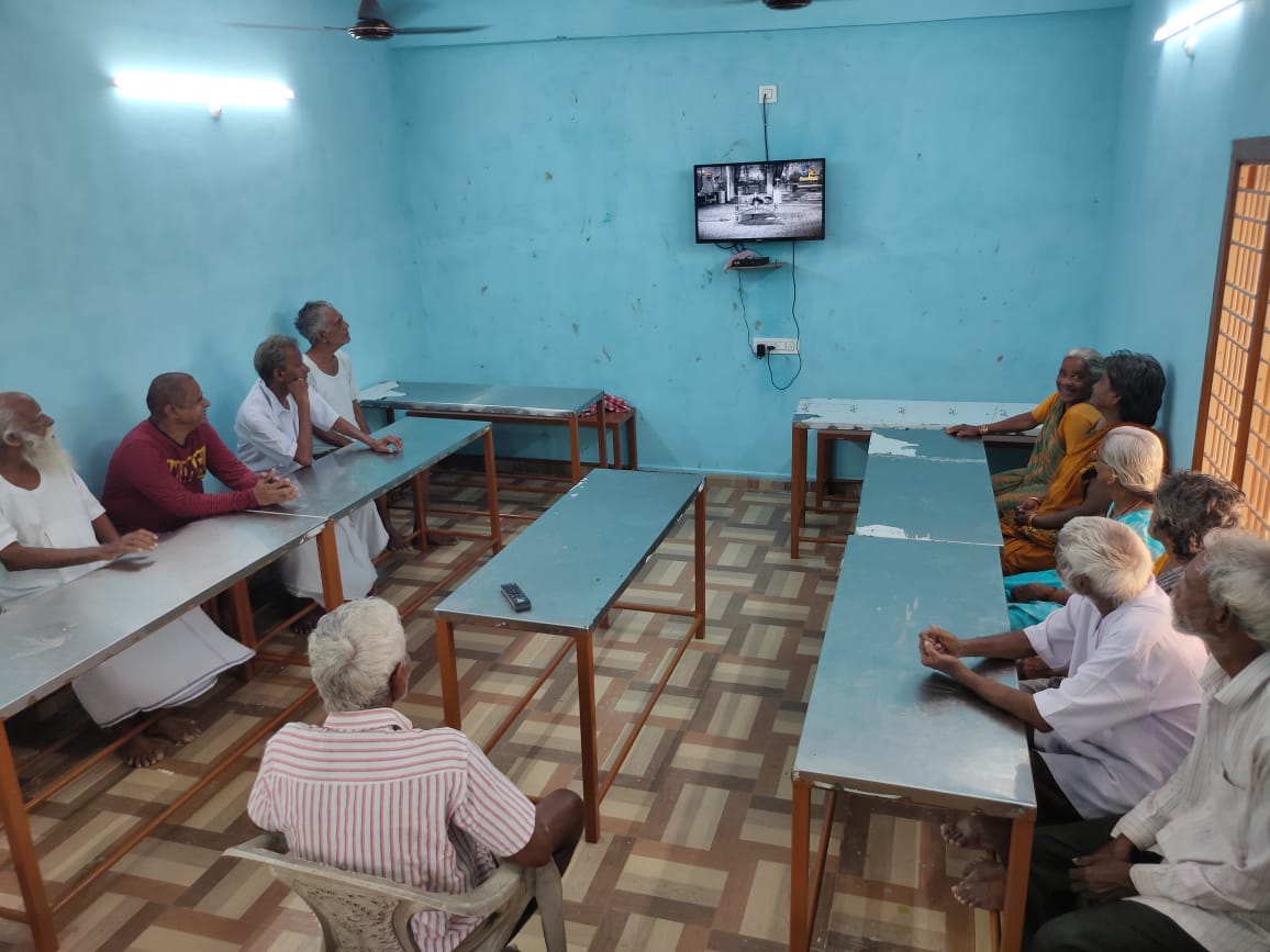 Residents in the common room at ABCD Old Age Home